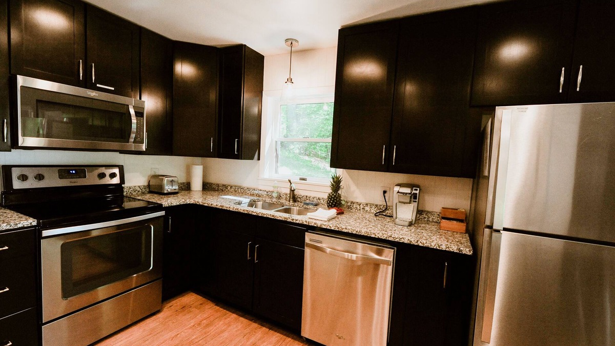 Lake Leelanau Cottage | Quaint cottage ON Lake Leelanau! Dock, deck, fire pit, large lawn!