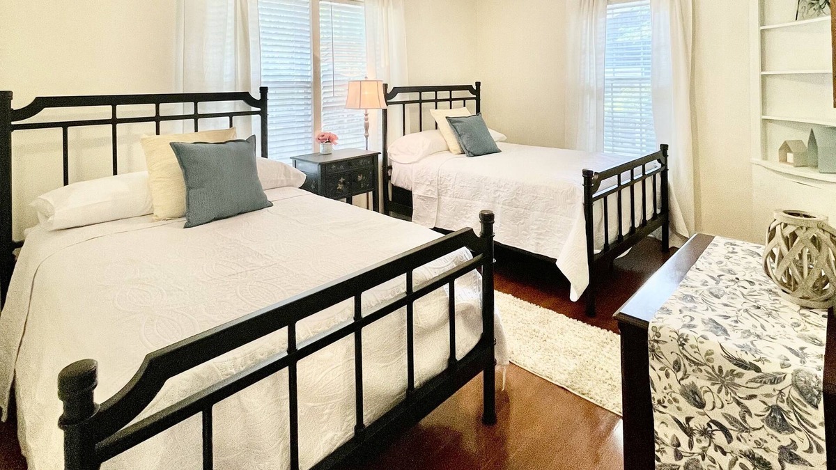 Midtown Cottage | Quaint cottage style home with two sitting areas-2 minutes to shops and eateries
