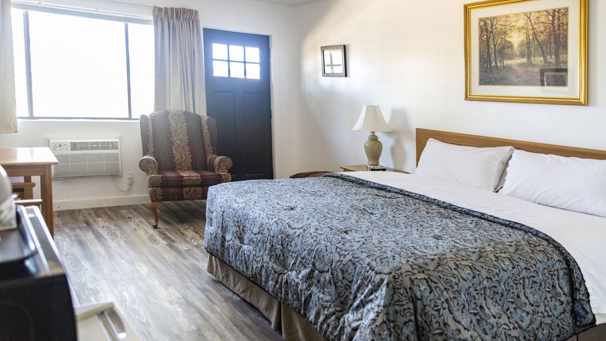 Delta Hotel | Quaint Single King Hotel Room overlooking the Gunnison River and your Private Patio! Perfect for fishing and exploring the outdoors.