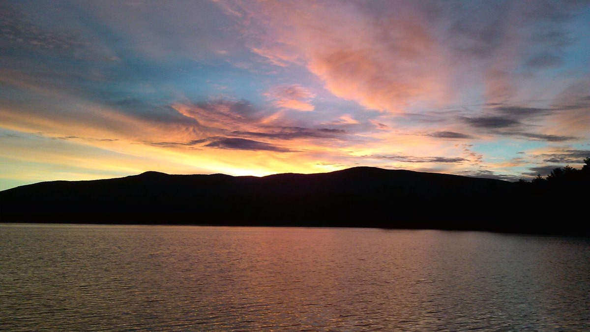 Moultonborough House | Quiet waterfront home on Lees Pond with Ossipee Mountain views.