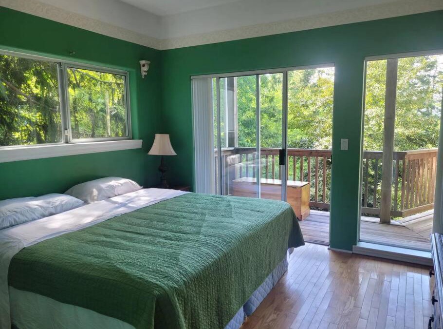 Powell River House | rainforest suite with a king size bed