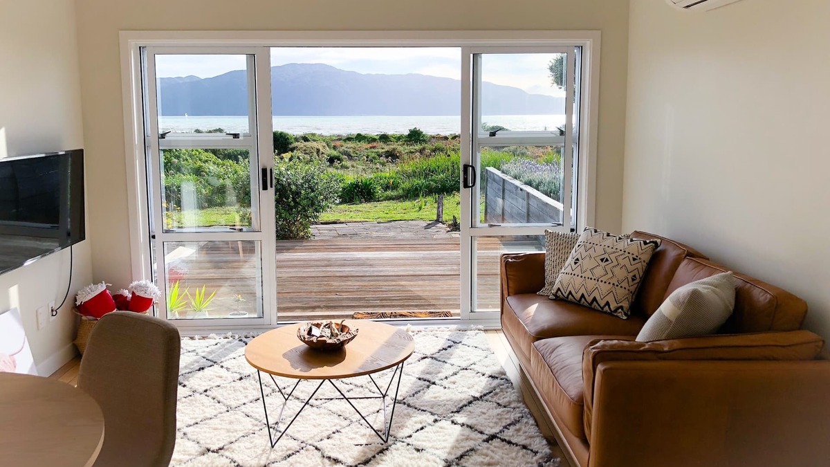 Paraparaumu Beach Apartment | RECENTLY RENOVATED PROPERTY RIGHT ON THE SAND! NEW DECK AND FREE WIFI!