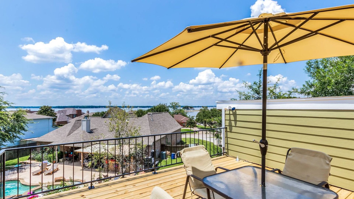 Seven Coves House | Relax and unwind on the deck with water view of Lake Conroe