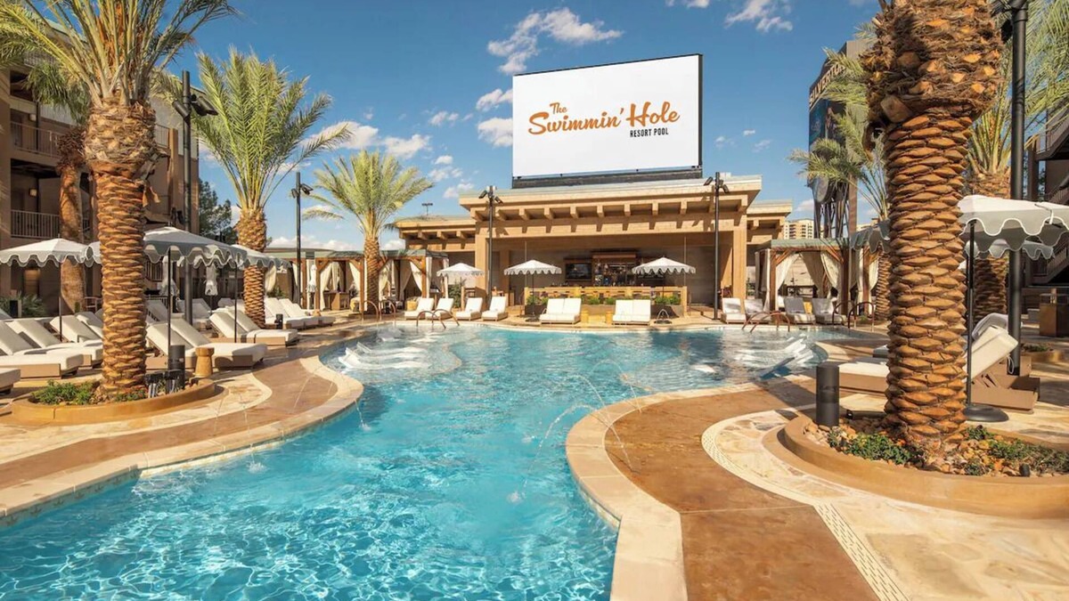 Enterprise Hotel | Relax in Comfort with a King Bed and Stunning Poolside Views