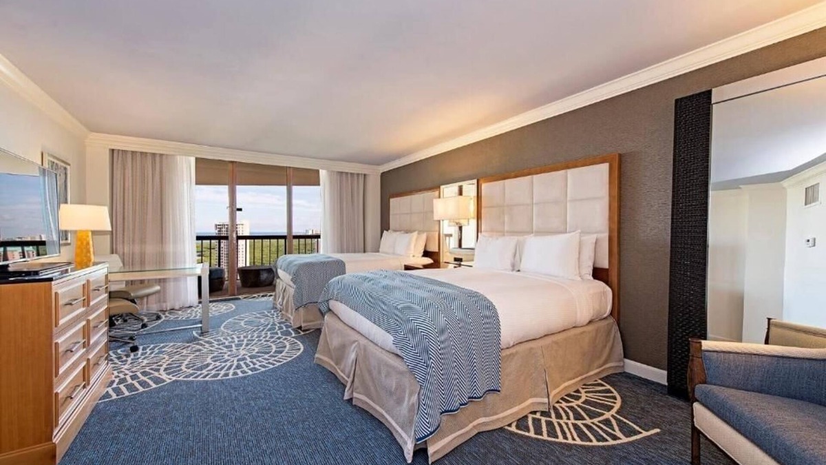 Pelican Bay Resort | Relax in Three Relaxing Rooms with Balcony, Beach & Outdoor Pool Access