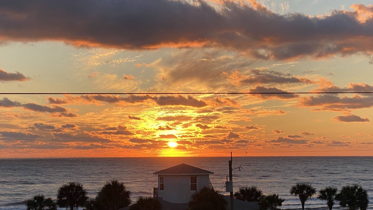 Bahama Beach Condo | Remodeled 3 BR/2BA condo steps to the beach! Sunset views and private garage.