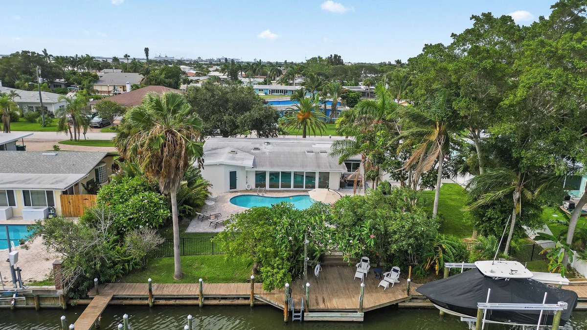 Venetian Way House | Remodeled Riverfront Pool and Dock Home in the Heart of Cocoa Beach.