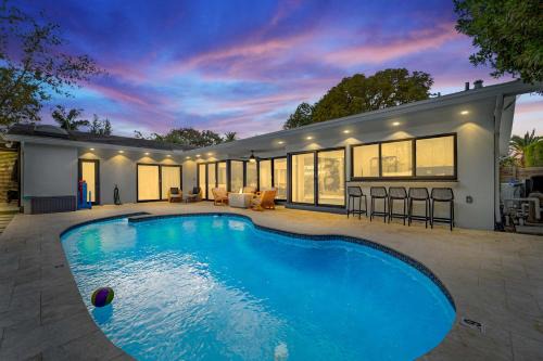 Imperial Point House | Resort Style Backyard Heated Pool Hot Tub Fire Pit