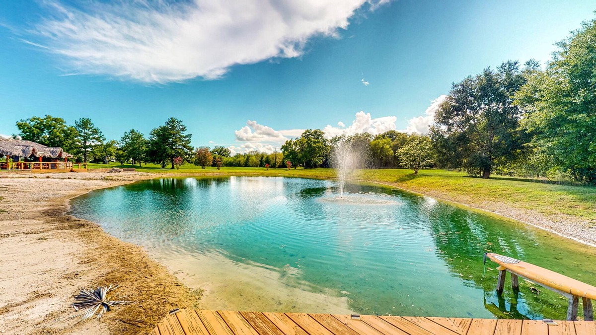 Waller House | Resort-Style Oasis with Swimming Pond, Beach, Tropical Hut & Bar