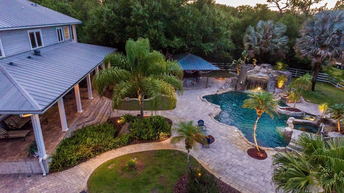 Greater Northdale House | Resort style pool with lazy river, grotto, and hot tub! Dog-Friendly!