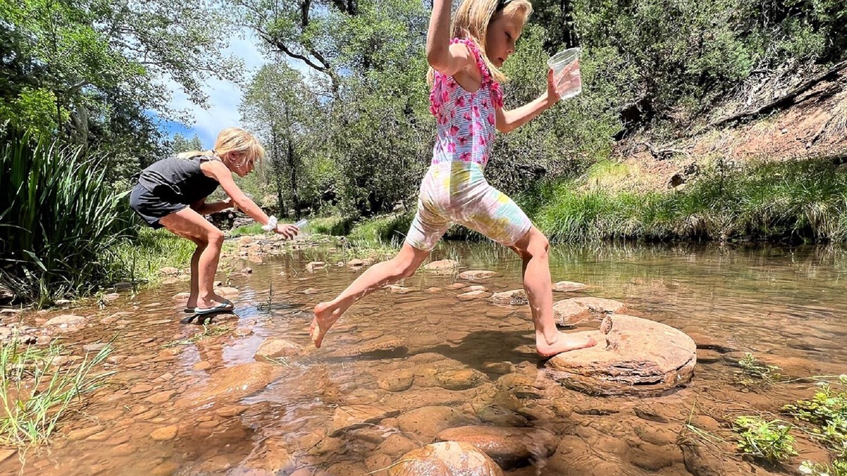 Whispering Pines Cabin | Riverfront Cabin with Hot Tub, Games & Wild Blackberry Trails