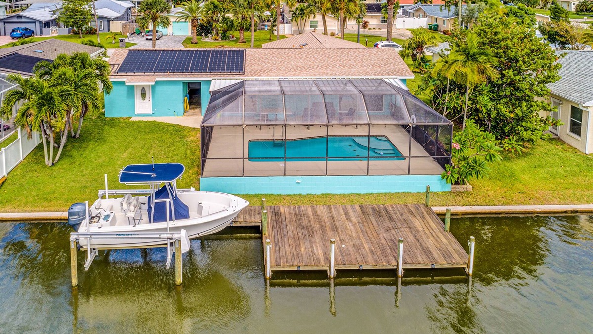 Venetian Way House | Riverfront home with private heated pool, dock, AC & W/D - dog-friendly