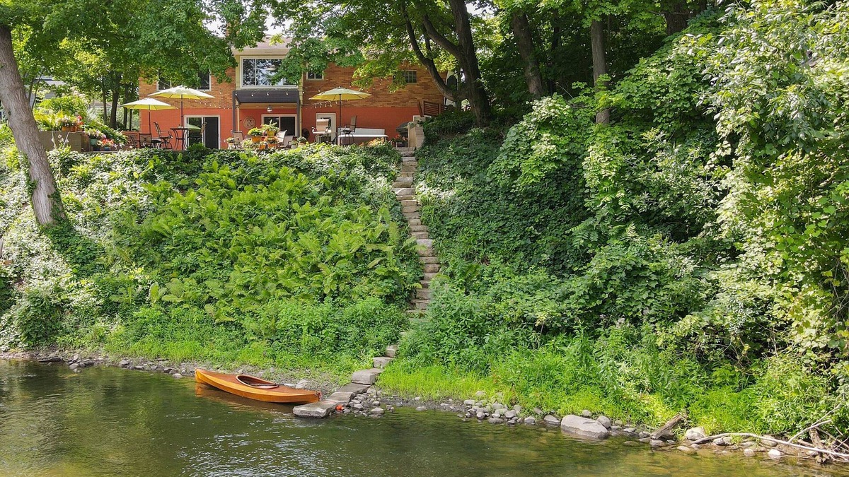 Dexter House | Riverside retreat with hot tub on the Huron River! 10 miles to UofM!