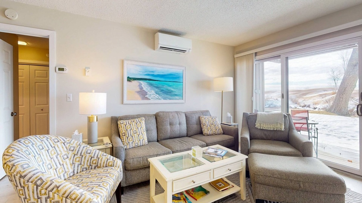 Maple City Condo | Riverview condo near the lake with beach access, fireplace, patio & cable