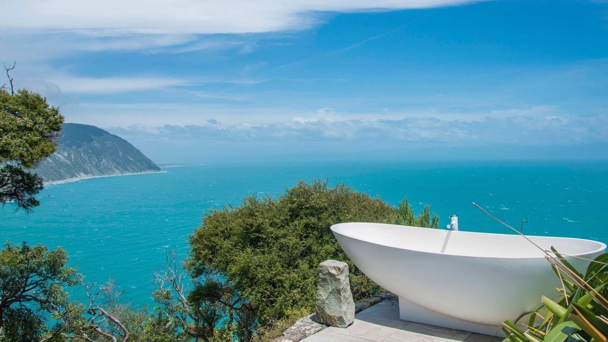 Nelson Region Cabin | Rocky Point Hut Pepin Island is nestled amongst native kanuka and coastal New Zealand bush