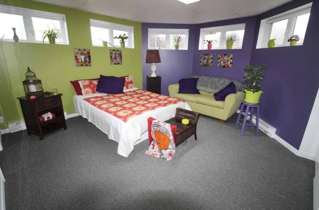 Notre-Dame-des-Monts House | Room in Guest room - Gandhi Very large room decorated in Indian style, office space and sofa
