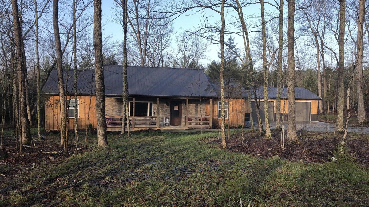 Winchester Cabin | Rustic Cabin with modern amenities and 1 acre stocked Fishing Lake !