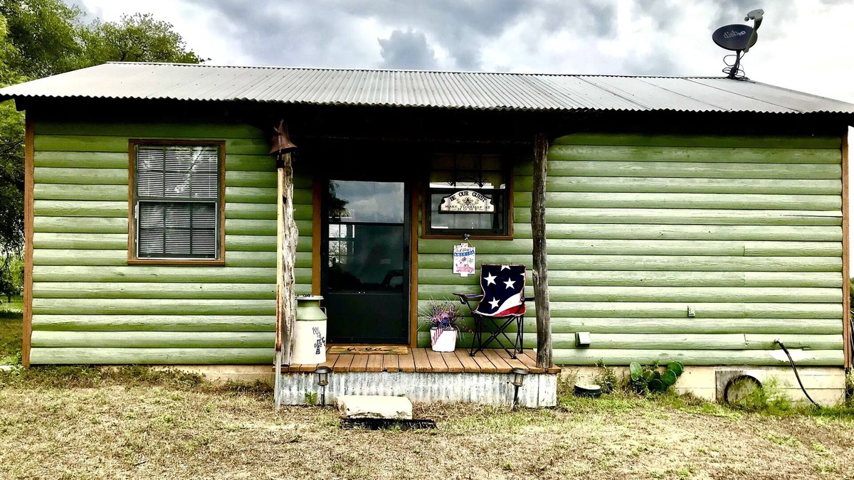 Gustine Cabin | Rustic cabin with peaceful view of windmill, pond and great sunsets. Gated.