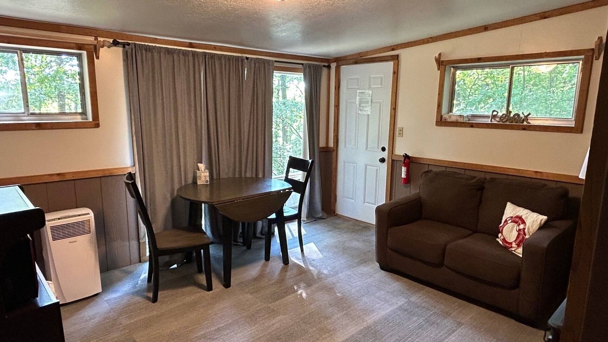 Palmyra Cottage | Rustic cabins in secluded campground with lake access and woods to wander in.