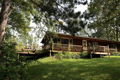 Tomah House | Rustic Family Cabin Rental with a Fire Pit near Wisconsin Dells