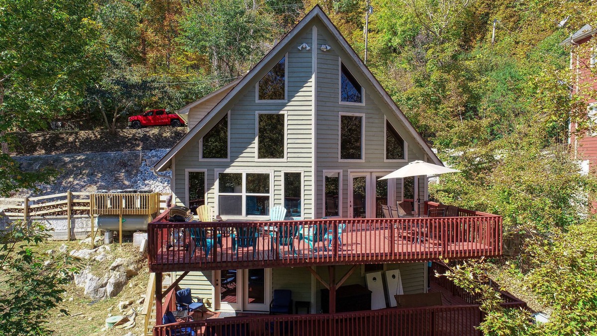 Speedwell Cabin | Rustic Lakefront Cabin with private double-deck dock, slide, hot tub, more!