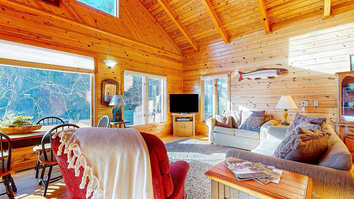 Clayton Cabin | Rustic two-story lakefront cabin near beach with dock, lake & mtn views, & deck
