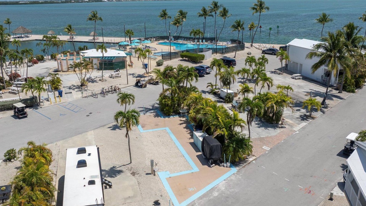 Cudjoe Key RV Rental | RV Lot 301 Venture Out, Pull-through Lot near the Ocean and Pool - Golf cart friendly!