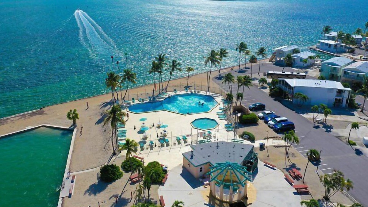 Cudjoe Key RV Rental | RV Lot 303 Venture Out, Pull-through Lot near the Ocean and Pool - Bring your golf cart!