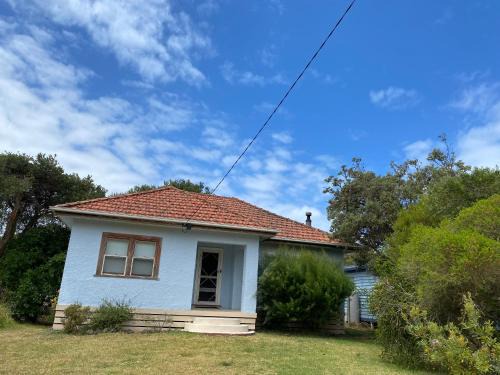 Sandy Point House | Sandy Sky Blue Shack