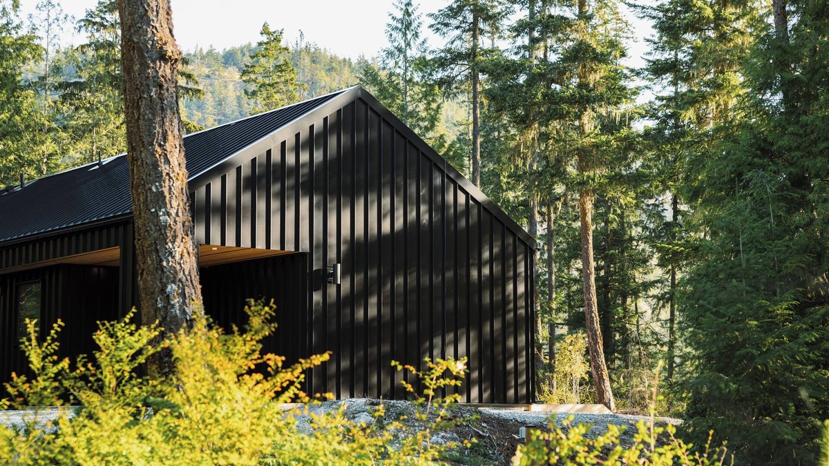 Garden Bay House | Scandinavian-inspired black cabin with cedar hot tub in a private forest.