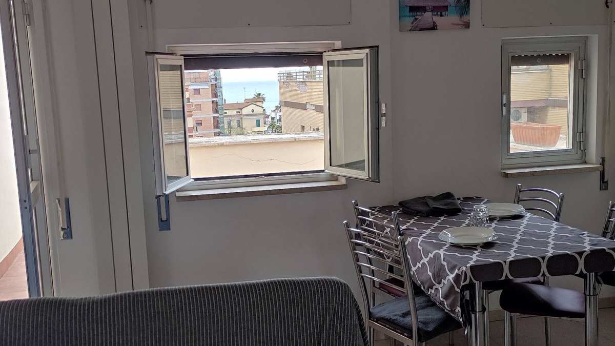 Quartiere XXXIV Lido di Ostia Levante Apartment | Sea view terrace 300 meters from the beach. and for the winter the fireplace.