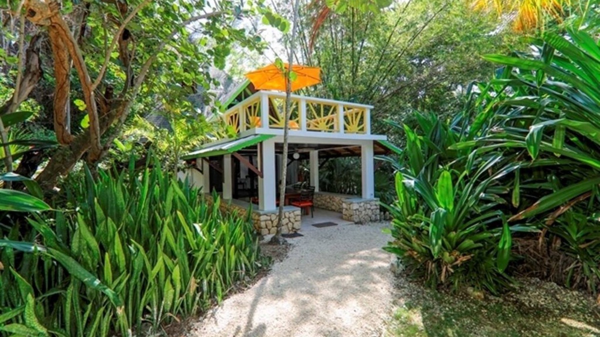 West End House | Seaside Garden Villa in Lush Cliffside Setting