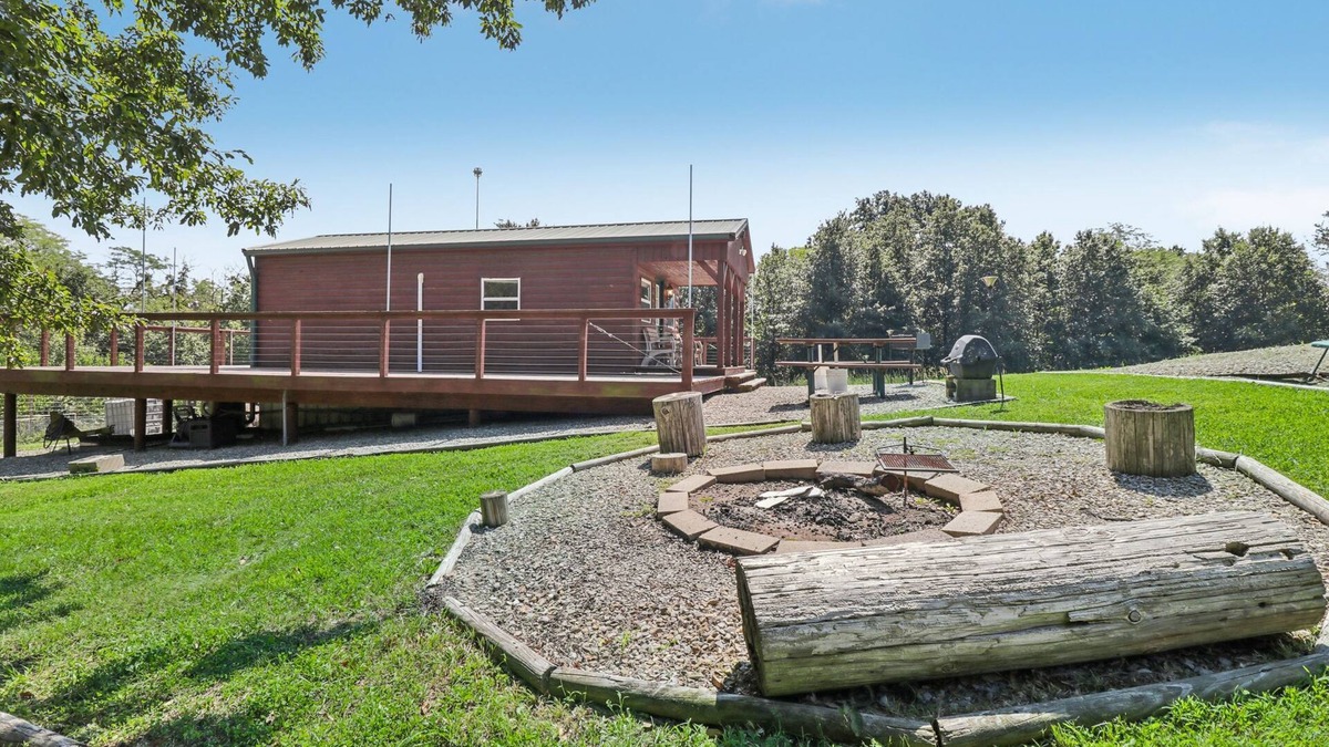 Fairport Cabin | Secluded cabin on farmland with fire pit, pond, a/c & treehouse