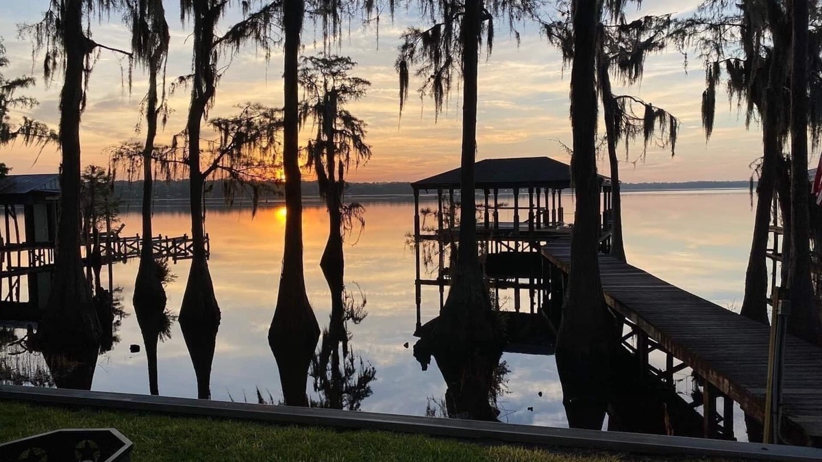 Clermont House | Secluded lake front w/private dock, boat lift, large screened porch