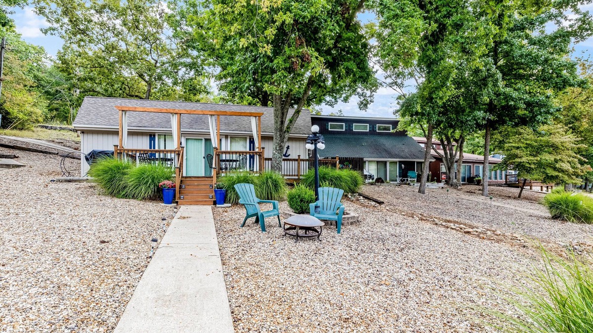 Sunrise Beach Cabin | Secluded lakefront home with private dock, firepit, grill, water views, hammock