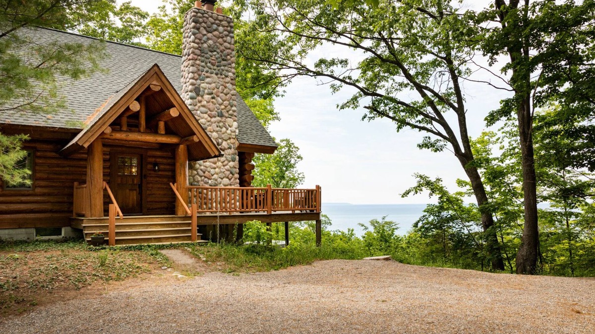 Lake Leelanau Cabin | Secluded Log Cabin Retreat on 11 Wooded Acres with Hot Tub & Lake Michigan Views