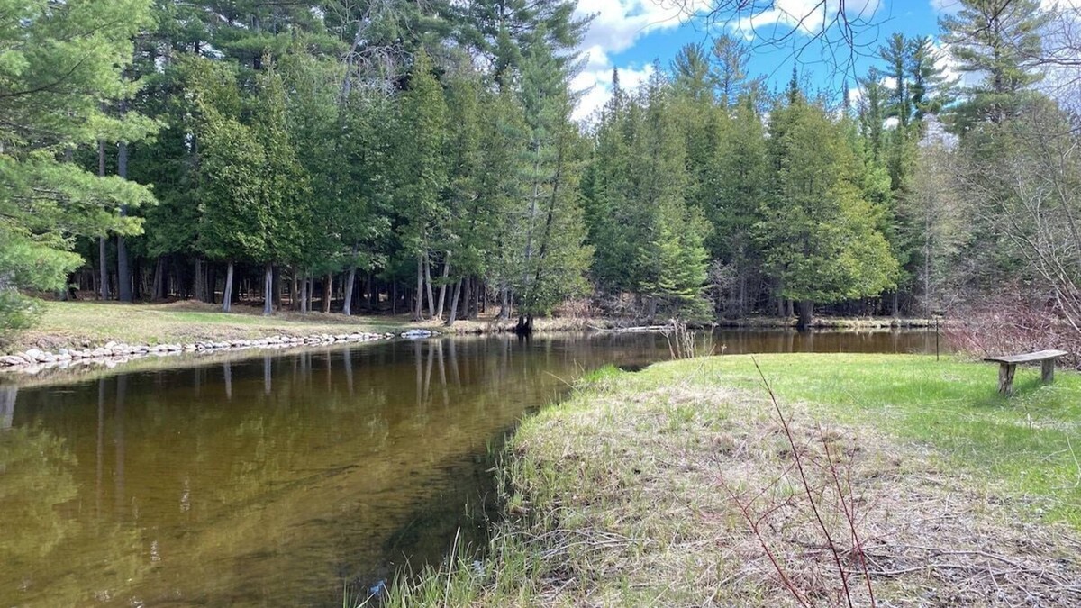 Grayling House | Secluded Riverfront Home in Grayling