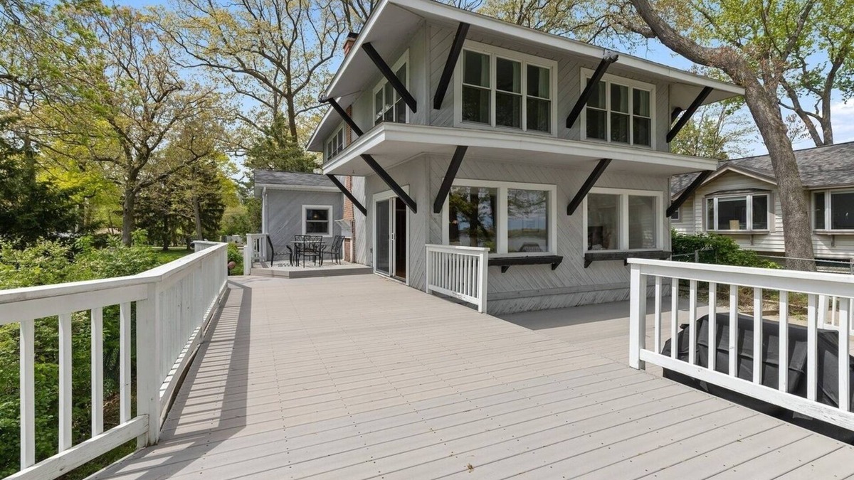 Channel Lake House | Serene lakefront house with expansive deck and pier