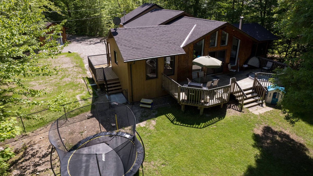 Haliburton Cottage | Serenity Now!nBeautiful Drag Lake. Beach, dock, hot tub and fire pit. Flat lot.