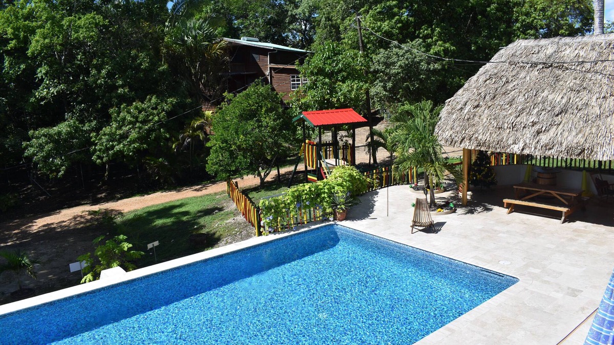 Unitedville Cabin | Set in jungle, Wild Orchid is a self catering 2 bedroom cabin with private porch