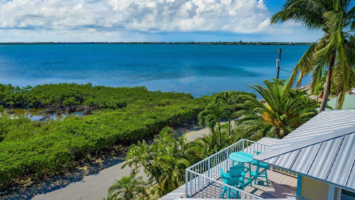 Eden Pines House | Slice of Paradise: Captivating Open Water Views, Deep Canal, Dockage, Heated Pool, and Pet-Friendly!