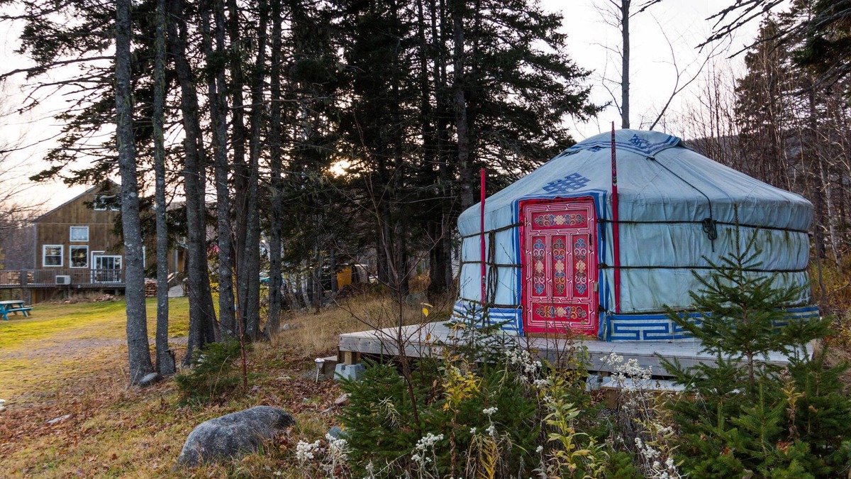 Indian Brook Resort | Small red yurt at Cabot Shores Wilderness Resort