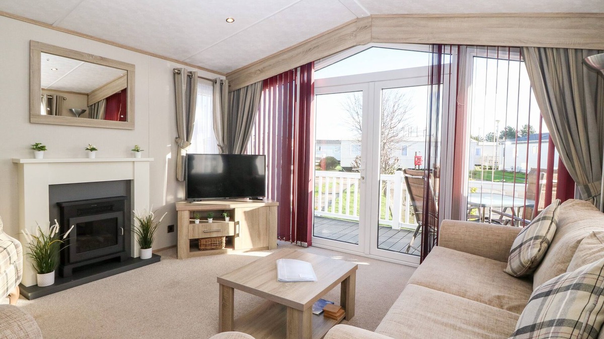 St George Cottage | SNAPE LODGE, pet friendly, with pool in Towyn