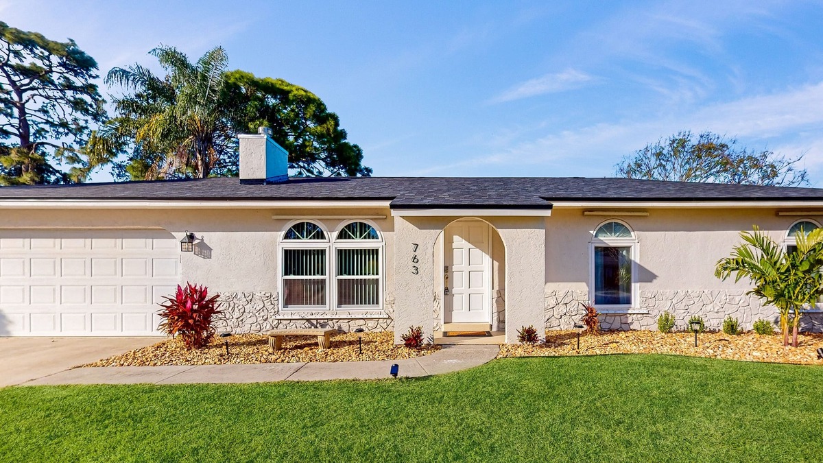 Palm Bay House | Snowbird-friendly home with open layout, enclosed yard, smart TV, AC, & W/D