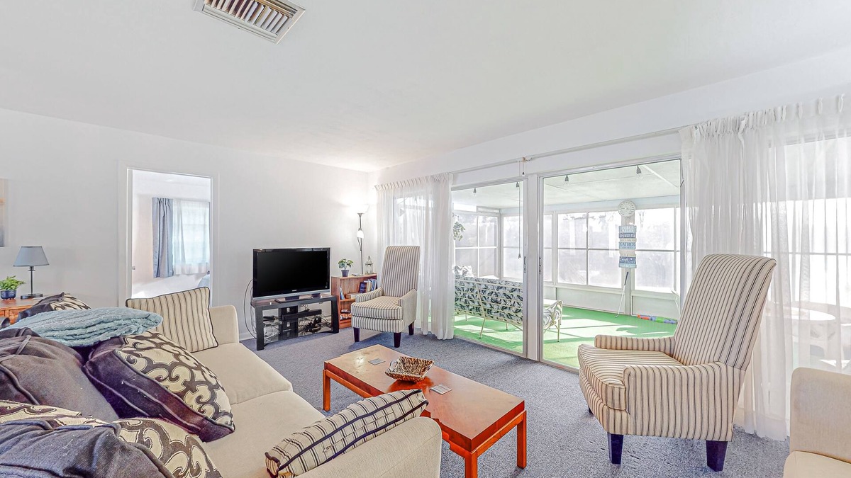 Spring Hill House | Snowbird-friendly waterfront home with water views, screened porch, streaming