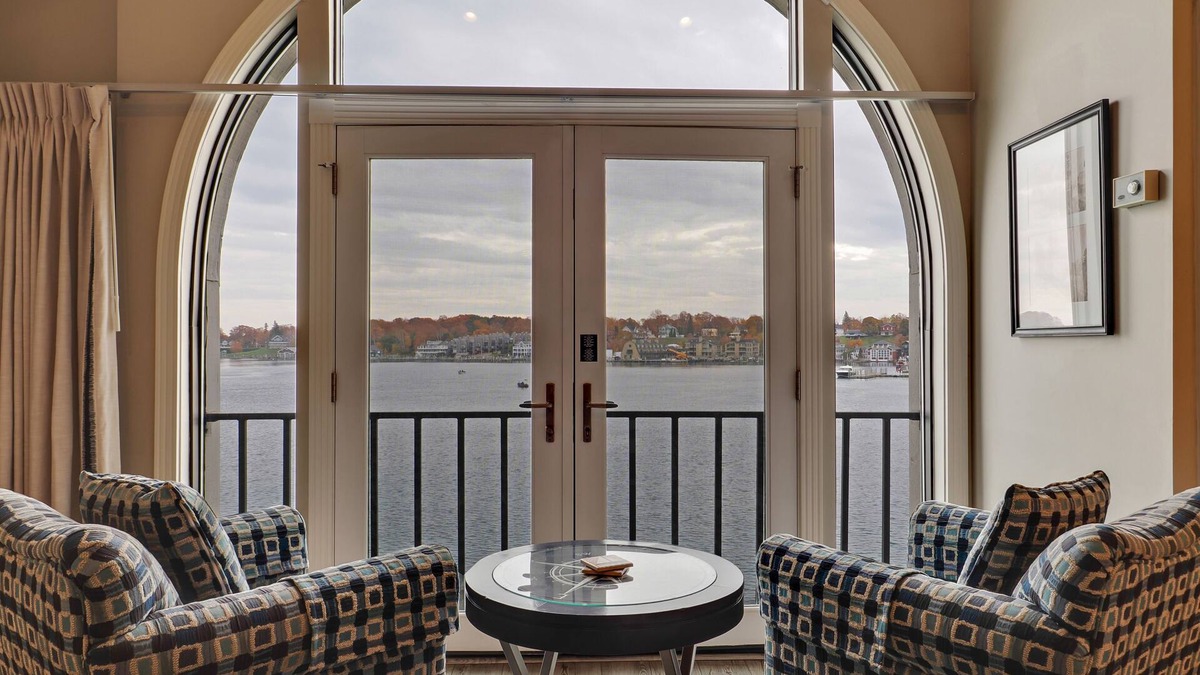 Charlevoix Condo | Soaring Ceilings & Lake Views | Downtown Charlevoix | Pool, Hot Tub, Sauna