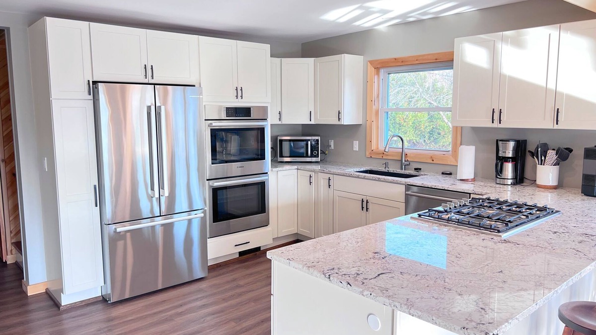 Alanson Cabin | Spacious Downtown Alanson Riverfront Cabin with Amenities- 10-12 guests