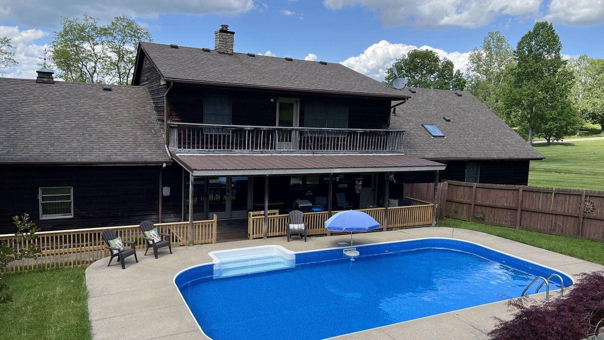 Keene House | Spacious family Lodge with solar heated pool, hot tub, fire pit and EV charger.