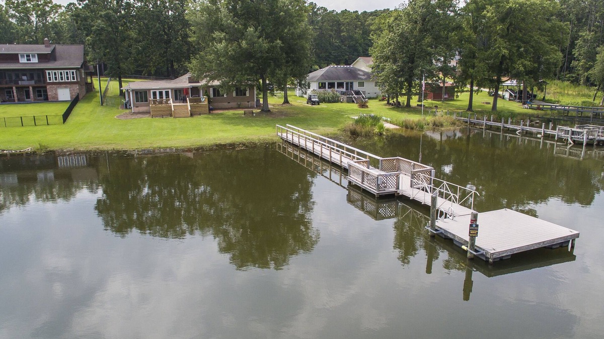 Prosperity House | Spacious grounds and home with large deck and dock in quiet cove.
