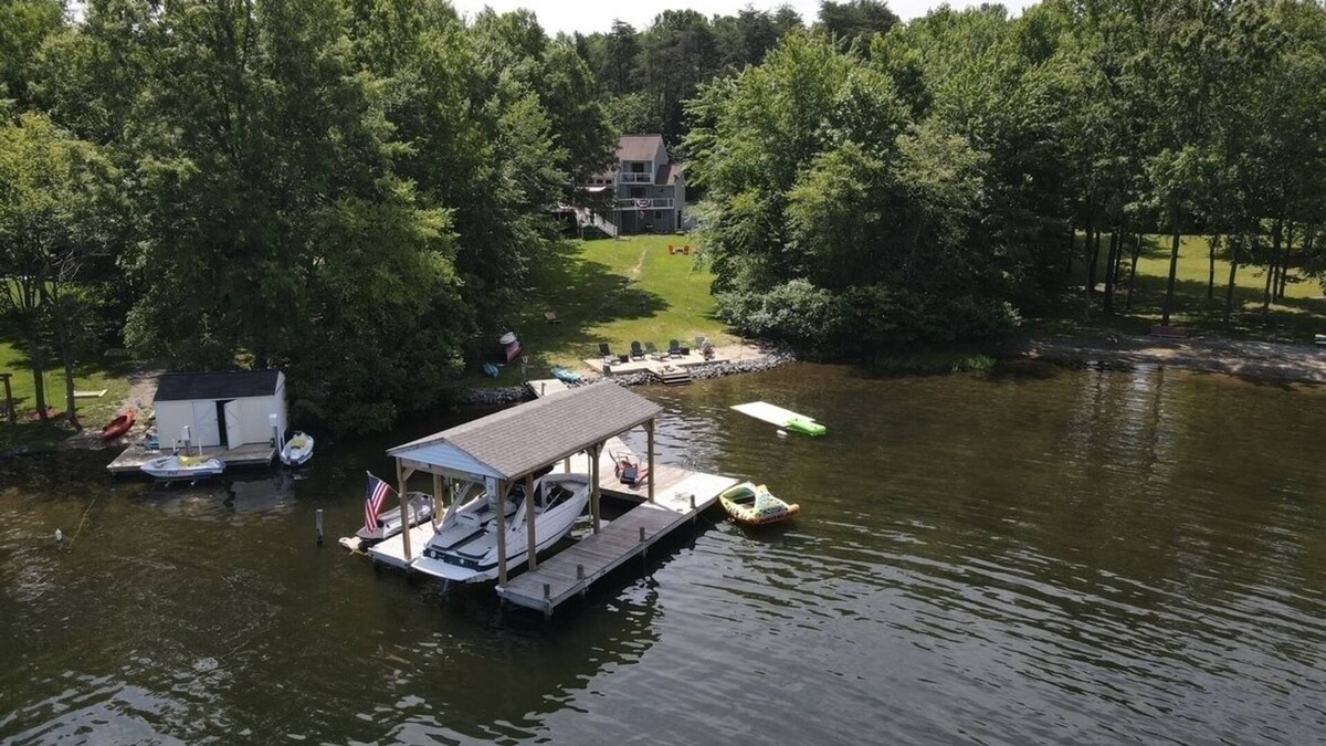 Bumpass House | Spacious lakeside home featuring a private cove, hot tub, dock & theater room